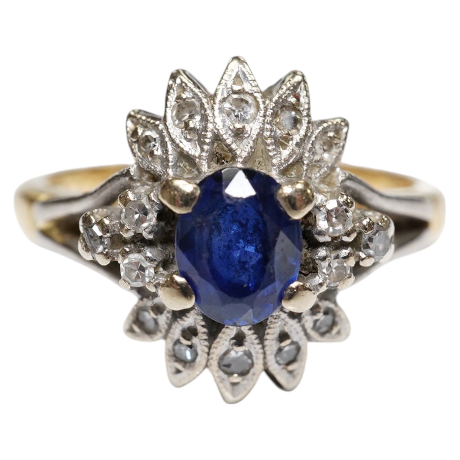 A modern 18ct gold, sapphire and diamond cluster set ring, size M/N, gross weight 4.6 grams. Condition - poor to fair